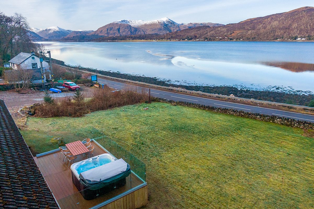 The decking and hot tub at Glenachulish Bay looking out across Loch Linnhe