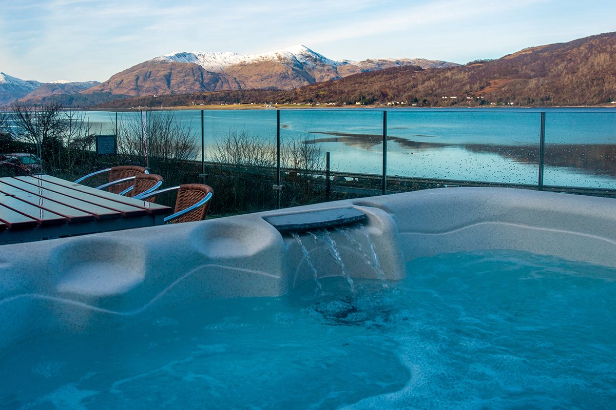 The hot tub at Glenachulish Bay with Loch Linnhe behind
