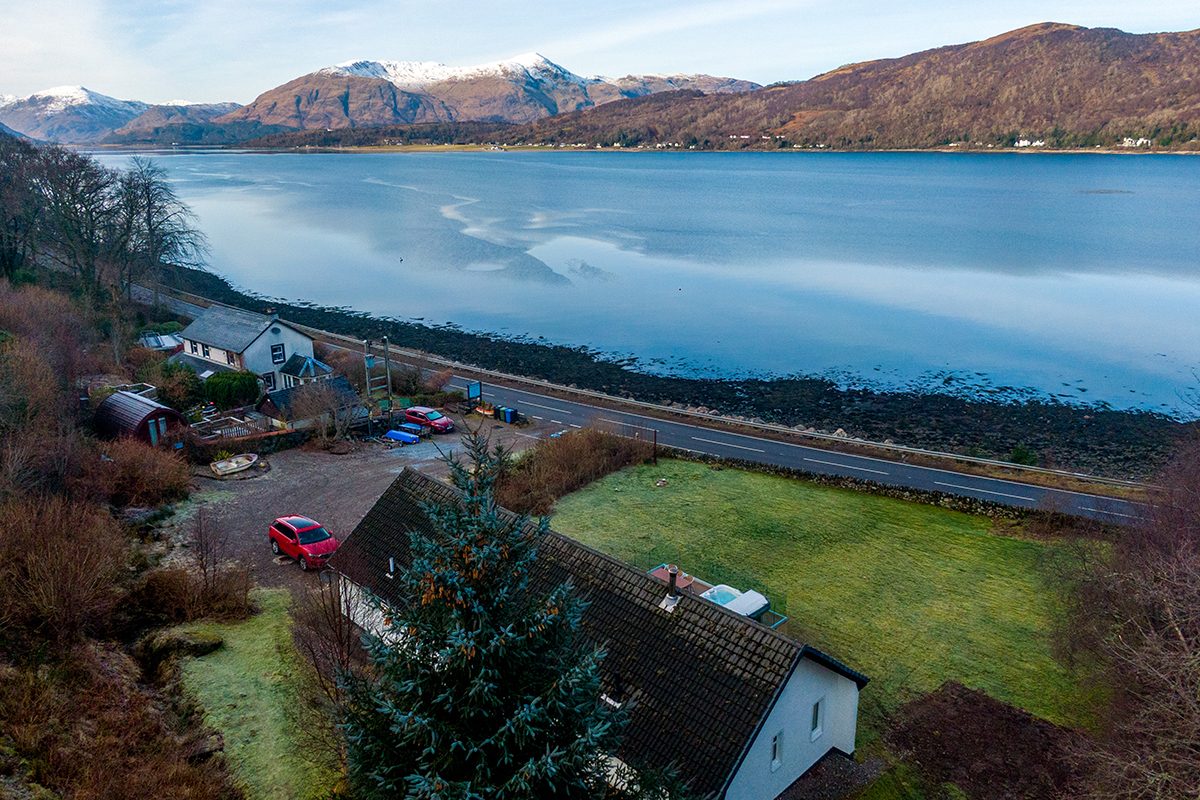 The cottage and its decking from the air