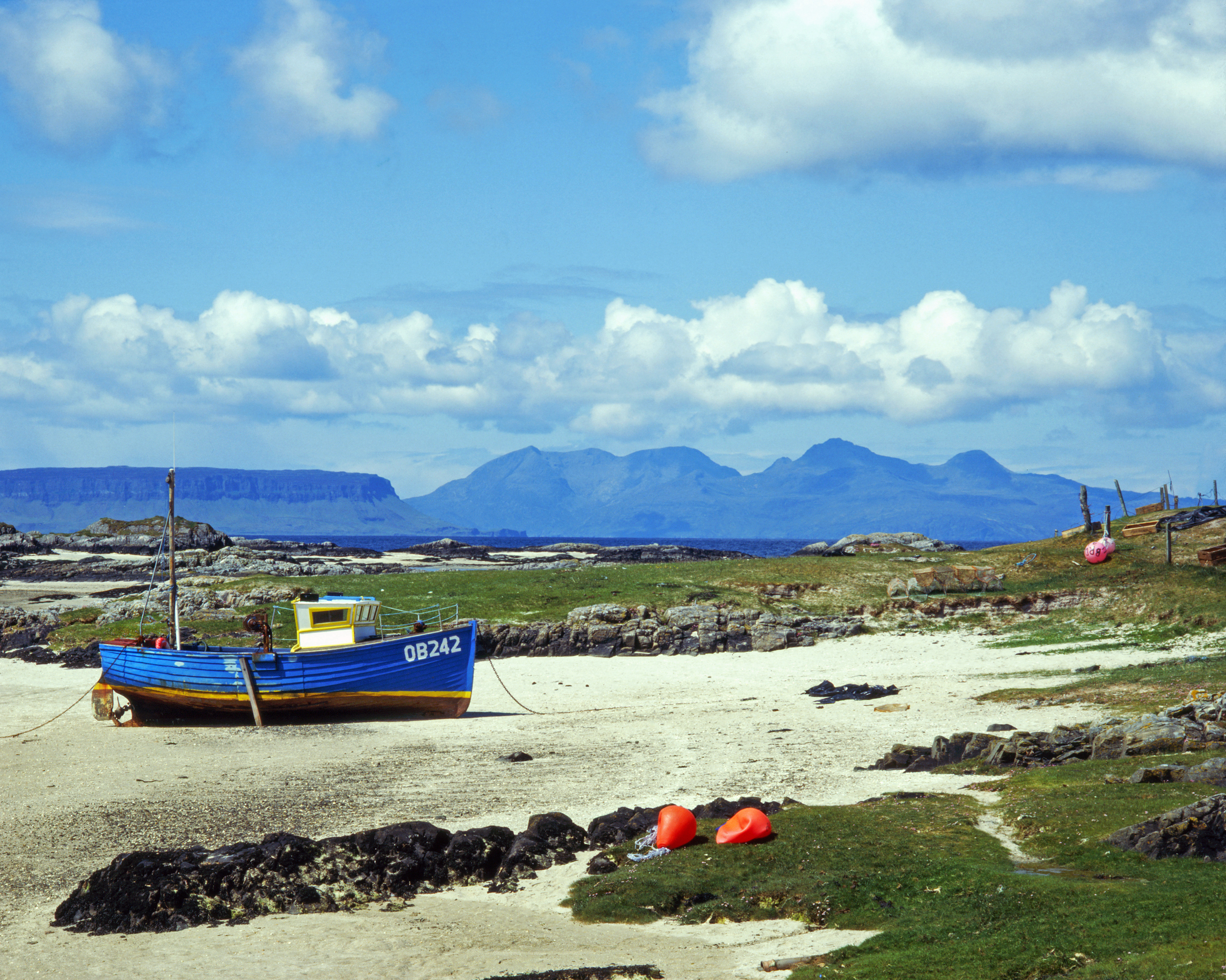 The white sands of Morar with a boat offshore